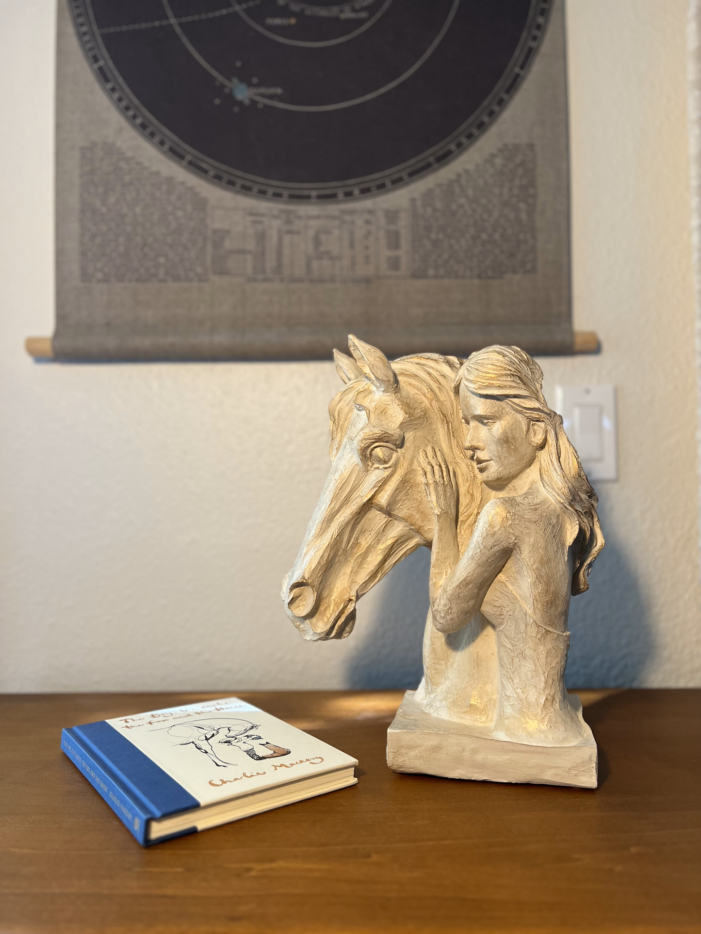 Decorative horse and woman statue symbolizing equestrian spirit, available in Black/Gold or Black/Silver colors.