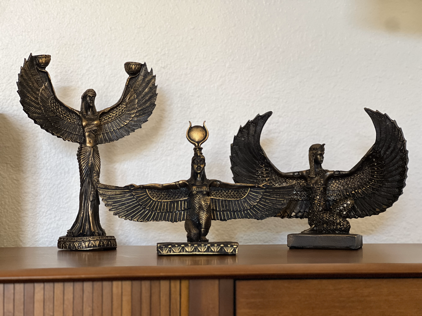 Egyptian figurine depicting Isis, available as individual pieces or sets of 2,3 or 4