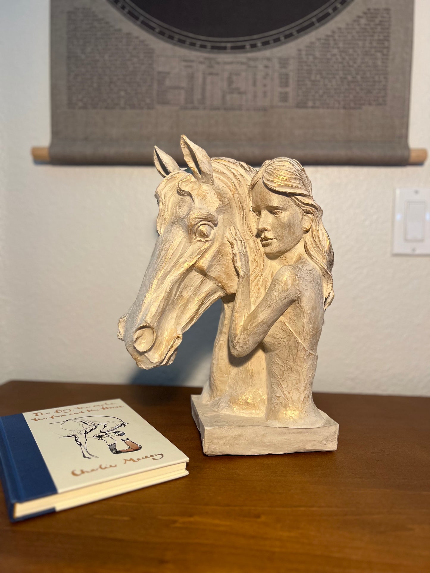 Decorative horse and woman statue symbolizing equestrian spirit, available in beige and beige gold colors.